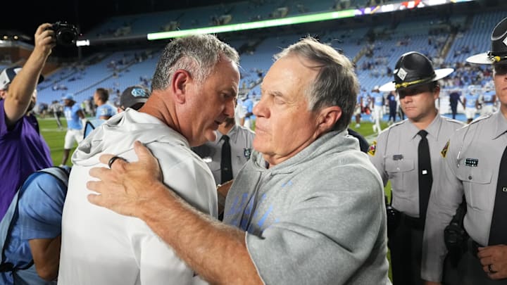 Sep 1, 2025; Chapel Hill, North Carolina, USA; North Carolina Tar Heels head coach Bill Belichick with TCU Horned Frogs head coach Sonny Dykes after the game at Kenan Stadium. Mandatory Credit: Bob Donnan-Imagn Images Sep 1, 2025; Chapel Hill, North Carolina, USA; North Carolina Tar Heels head coach Bill Belichick with TCU Horned Frogs head coach Sonny Dykes after the game at Kenan Stadium. Mandatory Credit: Bob Donnan-Imagn Images