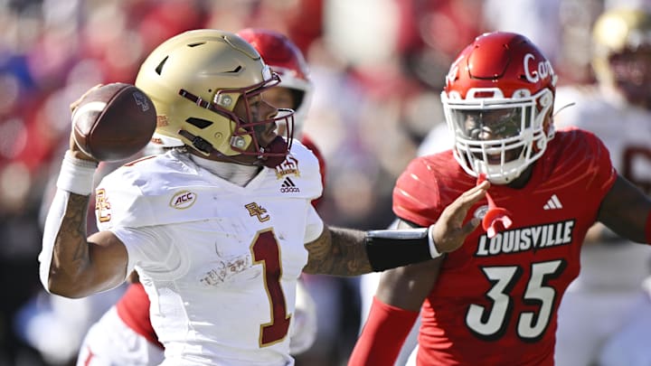 Sep 23, 2023; Louisville, Kentucky, USA;  Boston College Eagles quarterback Thomas Castellanos (1) looks to pass against Louisville Cardinals linebacker Antonio Watts (35) during the first half at L&N Federal Credit Union Stadium. 