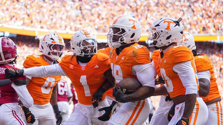 Tennessee players celebrate with Tennessee defensive lineman Tyree Weathersby (18) before the touchdown on an interception is overturned during a football game between Tennessee and Alabama at Neyland Stadium in Knoxville, Tenn., on Oct. 17, 2026.