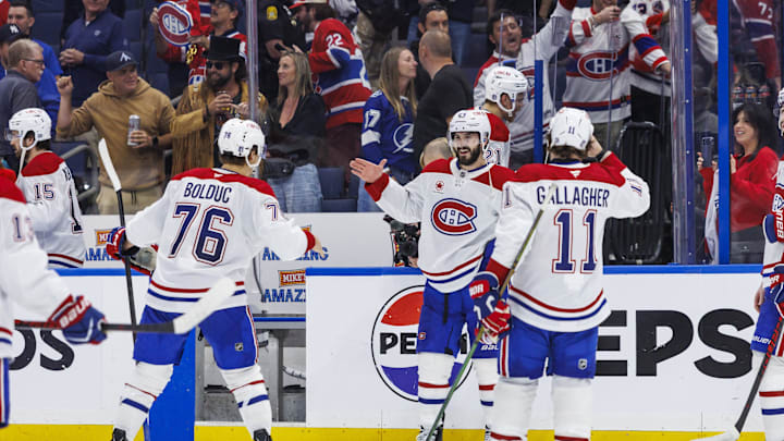 May 3, 2026; Tampa, Florida, USA; Montreal Canadiens forward Zachary Bolduc (76), forward Phillip Danault (24)  and forward Brendan Gallagher (11) react to beating the Tampa Bay Lightning in game seven of the first round of the 2026 Stanley Cup Playoffs at Benchmark International Arena. Mandatory Credit: Morgan Tencza-Imagn Images