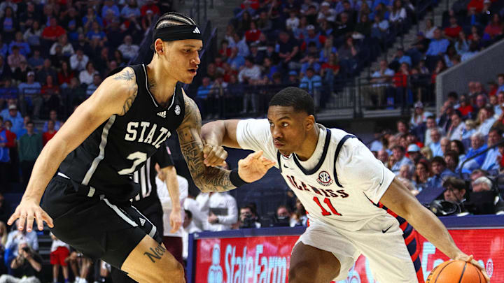 Feb 15, 2025; Oxford, Mississippi, USA; Mississippi Rebels guard Matthew Murrell (11) drives to the basket as Mississippi State Bulldogs guard Riley Kugel (2) defends during the second half at The Sandy and John Black Pavilion at Ole Miss. Mandatory Credit: Petre Thomas-Imagn Images