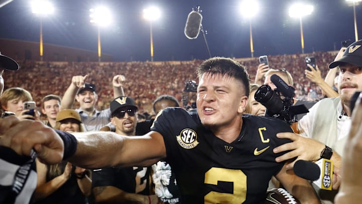 Oct 5, 2024; Nashville, Tennessee, USA;  Vanderbilt Commodores quarterback Diego Pavia celebrates with fans after defeating the Alabama Crimson Tide during the second half at FirstBank Stadium. Mandatory Credit: Butch Dill-Imagn Images