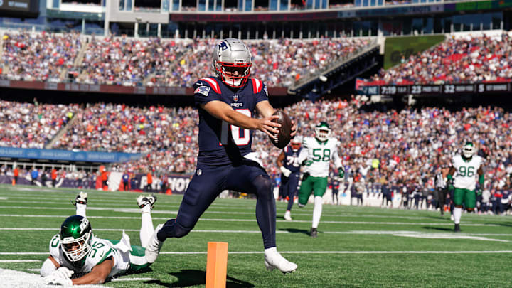 Oct 27, 2024; Foxborough, Massachusetts, USA; New England Patriots quarterback Drake Maye (10) runs the ball for a touchdown against the New York Jets in the first quarter at Gillette Stadium. Mandatory Credit: David Butler II-Imagn Images