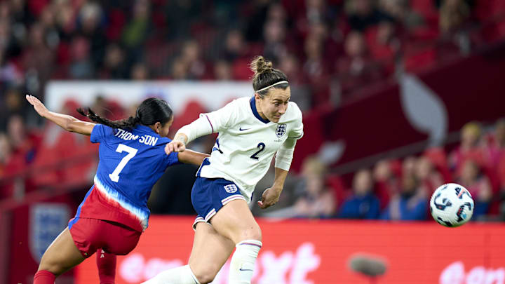 Nov 30, 2024; London, England; England defender Lucy Bronze (2) gets past United states forward Alyssa Thompson (7)  in the first half of an International friendly at Wembley Stadium. Mandatory Credit: Peter van den Berg-Imagn Images
