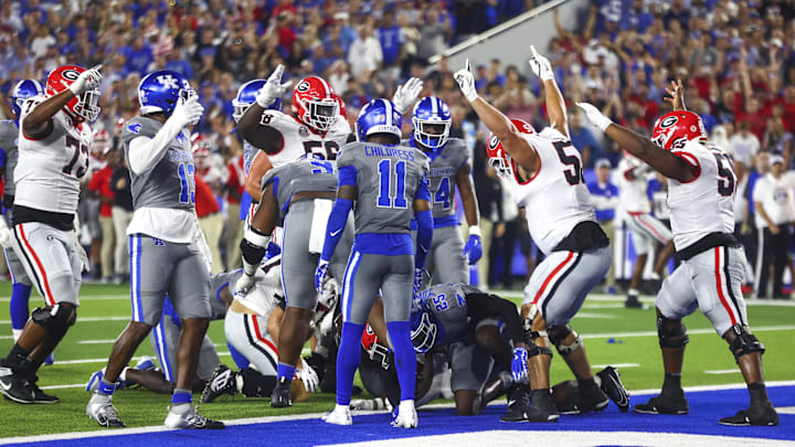 Sep 14, 2024; Lexington, Kentucky, USA; Georgia Bulldogs running back Branson Robinson (22) scores a touchdown during the second half against Kentucky at Kroger Field. Georgia won 13-12. Mandatory Credit: Carter Skaggs-Imagn Images