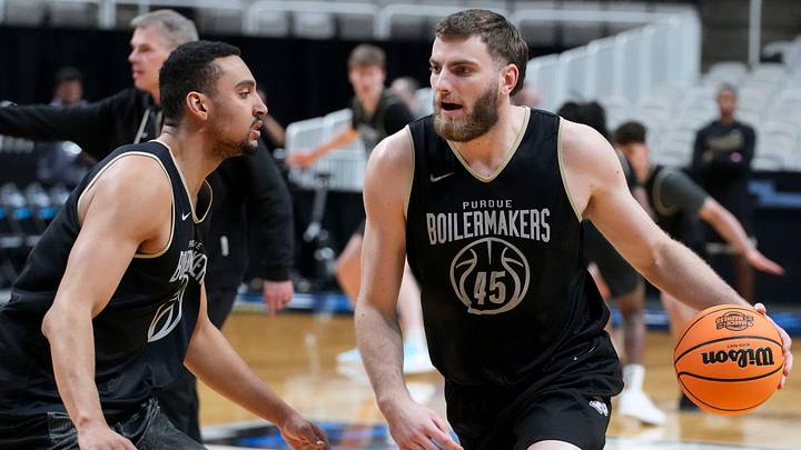 Purdue Boilermakers center Oscar Cluff (45) attempts to get past forward Trey Kaufman-Renn (4) during practice.