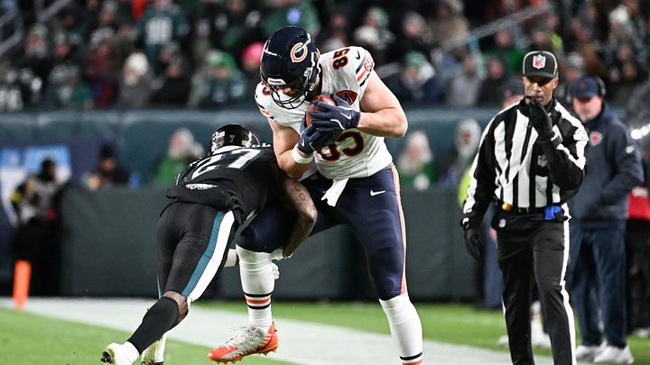 Nov 28, 2025; Philadelphia, Pennsylvania, USA; Philadelphia Eagles cornerback Quinyon Mitchell (27) tackles Chicago Bears tight end Cole Kmet (85) during the fourth quarter of the game at Lincoln Financial Field. Mandatory Credit: Eric Hartline-Imagn Images