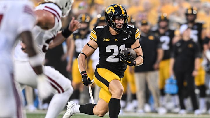 Sep 13, 2025; Iowa City, Iowa, USA; Iowa Hawkeyes wide receiver Kaden Wetjen (21) runs for a touchdown during the first quarter against the Massachusetts Minutemen at Kinnick Stadium. Mandatory Credit: Jeffrey Becker-Imagn Images