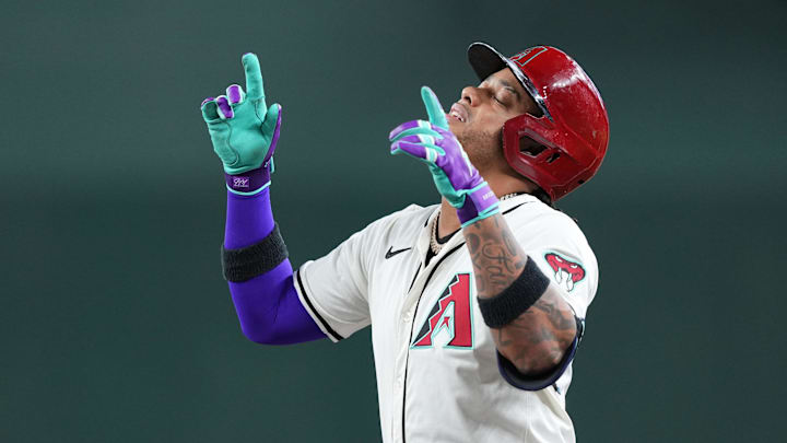 Sep 29, 2024; Phoenix, Arizona, USA; Arizona Diamondbacks second base Ketel Marte (4) reacts after hitting a single against the San Diego Padres during the first inning at Chase Field. Mandatory Credit: Joe Camporeale-Imagn Images