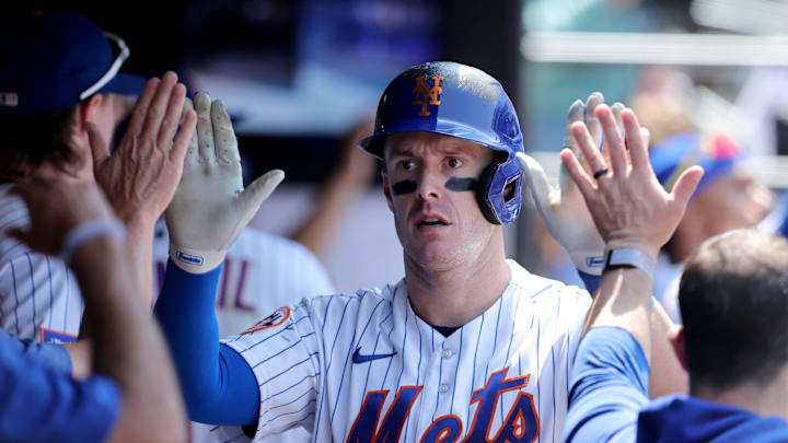 Jun 1, 2023; New York City, New York, USA; New York Mets left fielder Mark Canha (19) celebrates his two run home run against the Philadelphia Phillies in the dugout with teammates during the fourth inning at Citi Field. Mandatory Credit: Brad Penner-Imagn Images