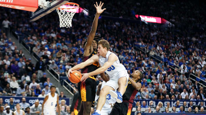Dallin Hall swings a dish across the court.