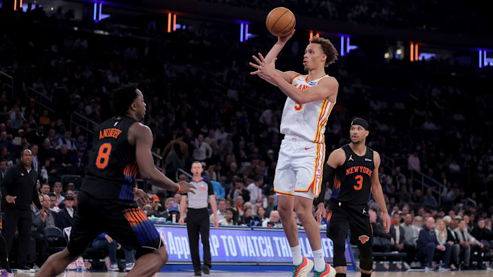 Apr 28, 2026; New York, New York, USA; Atlanta Hawks guard Dyson Daniels (5) takes a shot against New York Knicks forward OG Anunoby (8) and guard Josh Hart (3) during the third quarter of game five of the first round of the 2026 NBA Playoffs at Madison Square Garden. Mandatory Credit: Brad Penner-Imagn Images