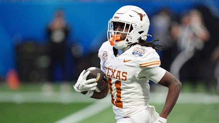 Jan 1, 2025; Atlanta, GA, USA; Texas Longhorns wide receiver Silas Bolden (11) returns a punt for a touchdown against the Arizona State Sun Devils during the first half of the Peach Bowl at Mercedes-Benz Stadium.