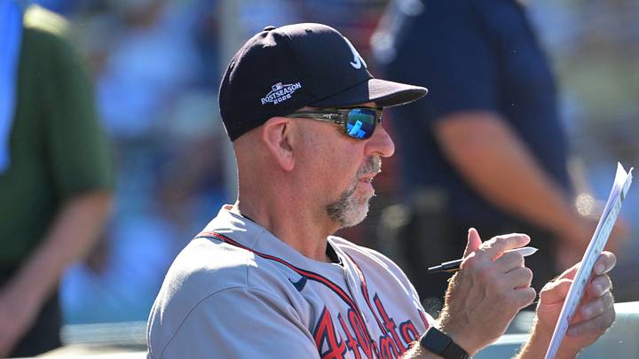 Oct 3, 2026; Los Angeles, California, USA;  Atlanta Braves manager Walt Weiss (22) stands in the dugout during the ninth inning of game one of the NLDS against the Los Angeles Dodgers for the 2026 MLB Playoffs at Uniqlo Field at Dodger Stadium.  Mandatory Credit: Jayne Kamin-Oncea-Imagn Images