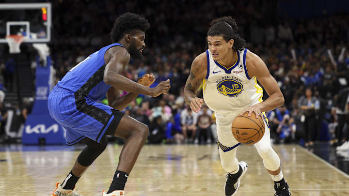 Mar 27, 2024; Orlando, Florida, USA; Orlando Magic forward Jonathan Isaac (1) guards Golden State Warriors forward Gui Santos (15) in the third quarter at the Kia Center. Mandatory Credit: Nathan Ray Seebeck-Imagn Images