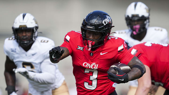 Oct 11, 2025; Cincinnati, Ohio, USA; Cincinnati Bearcats running back Tawee Walker (3) runs with the ball against the UCF Knights in the first half at Nippert Stadium. Mandatory Credit: Aaron Doster-Imagn Images Oct 11, 2025; Cincinnati, Ohio, USA; Cincinnati Bearcats running back Tawee Walker (3) runs with the ball against the UCF Knights in the first half at Nippert Stadium. Mandatory Credit: Aaron Doster-Imagn Images