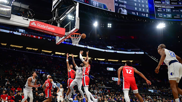 Apr 4, 2025; Inglewood, California, USA; Dallas Mavericks forward Naji Marshall (13) plays for the rebound against Los Angeles Clippers guard Trentyn Flowers (9) and forward Patrick Baldwin Jr. (23) during the second half at Intuit Dome. Mandatory Credit: Gary A. Vasquez-Imagn Images Apr 4, 2025; Inglewood, California, USA; Dallas Mavericks forward Naji Marshall (13) plays for the rebound against Los Angeles Clippers guard Trentyn Flowers (9) and forward Patrick Baldwin Jr. (23) during the second half at Intuit Dome. Mandatory Credit: Gary A. Vasquez-Imagn Images