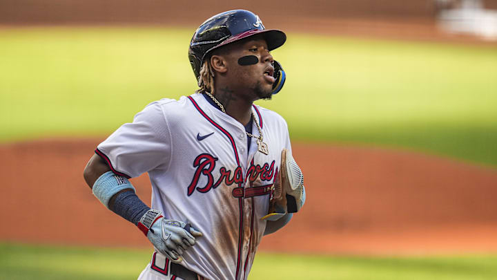 Atlanta Braves right fielder Ronald Acuna Jr (13) scores a run against the San Diego Padres during the first inning at Truist Park. 