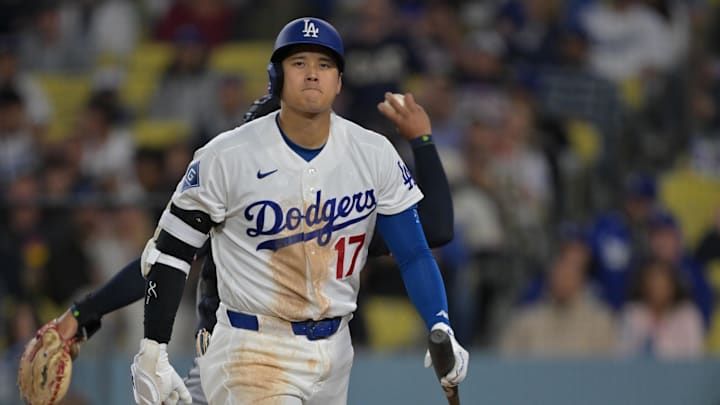 Apr 1, 2026; Los Angeles, California, USA;  Los Angeles Dodgers two-way player Shohei Ohtani (17) returns to the dugout after he was called out on a checked swing with bases loaded to end in the eighth inning against the Cleveland Guardians at Dodger Stadium. Mandatory Credit: Jayne Kamin-Oncea-Imagn Images