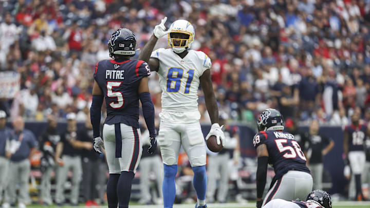 Oct 2, 2022; Houston, Texas, USA; Los Angeles Chargers wide receiver Mike Williams (81) signals