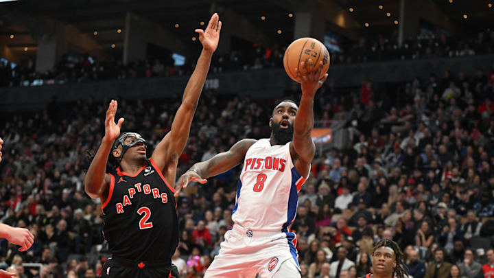 Apr 4, 2025; Toronto, Ontario, CAN;  Detroit Pistons guard Tim Hardaway Jr. (8) shoots the ball against Toronto Raptors forward Jonathan Mogbo (2) in the first half at Scotiabank Arena. Mandatory Credit: Dan Hamilton-Imagn Images