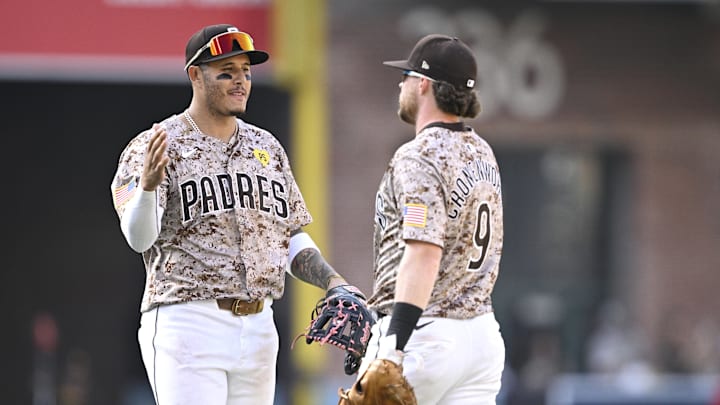 San Diego Padres third baseman Manny Machado (13) and second baseman Jake Cronenworth (9) celebrate on the field after defeating the Chicago White Sox at Petco Park on Sept 22. San Diego Padres third baseman Manny Machado (13) and second baseman Jake Cronenworth (9) celebrate on the field after defeating the Chicago White Sox at Petco Park on Sept 22.