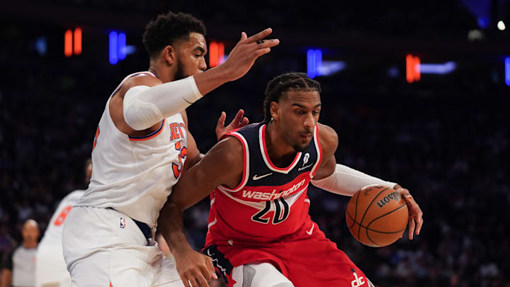 Nov 3, 2025; New York, New York, USA; New York Knicks center Karl-Anthony Towns (32) defends Washington center Alex Sarr (20) during the second half at Madison Square Garden. Mandatory Credit: Lucas Boland-Imagn Images