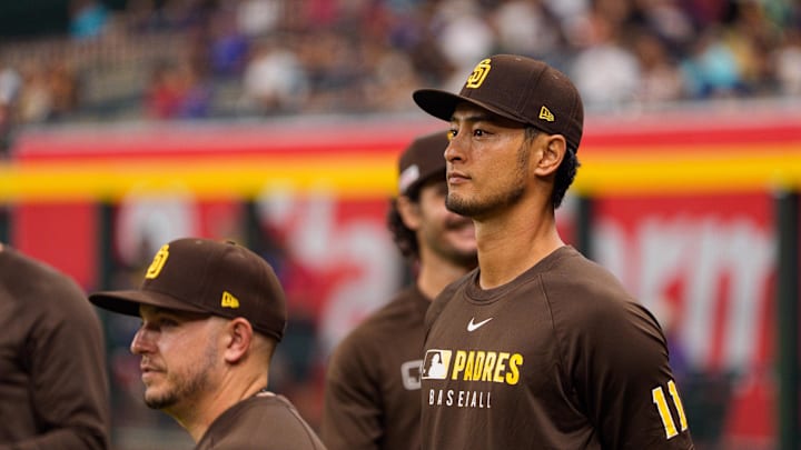 Jun 14, 2025; Phoenix, Arizona, USA; San Diego Padres pitcher Yu Darvish (11) watches before the start a game against the Arizona Diamondbacks at Chase Field. Mandatory Credit: Allan Henry-Imagn Images Jun 14, 2025; Phoenix, Arizona, USA; San Diego Padres pitcher Yu Darvish (11) watches before the start a game against the Arizona Diamondbacks at Chase Field. Mandatory Credit: Allan Henry-Imagn Images