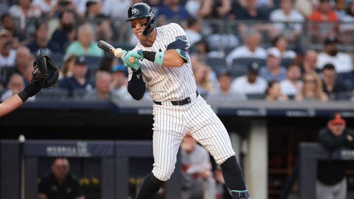 Jun 18, 2024; Bronx, New York, USA; New York Yankees center fielder Aaron Judge (99) is hit by a pitch during the third inning against the Baltimore Orioles at Yankee Stadium. Mandatory Credit: Vincent Carchietta-USA TODAY Sports