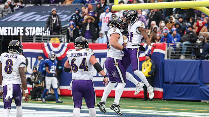 Dec 15, 2024; East Rutherford, New Jersey, USA; Baltimore Ravens wide receiver Devontez Walker (81) celebrates his touchdown with teammates during the second half against the New York Giants at MetLife Stadium. Mandatory Credit: Vincent Carchietta-Imagn Images Dec 15, 2024; East Rutherford, New Jersey, USA; Baltimore Ravens wide receiver Devontez Walker (81) celebrates his touchdown with teammates during the second half against the New York Giants at MetLife Stadium. Mandatory Credit: Vincent Carchietta-Imagn Images
