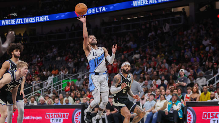 Feb 7, 2025; Atlanta, Georgia, USA; Atlanta Hawks guard Trae Young (11) shoots against the Milwaukee Bucks in the fourth quarter at State Farm Arena. Mandatory Credit: Brett Davis-Imagn Images