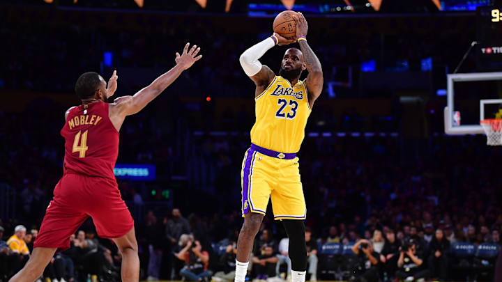 Dec 31, 2024; Los Angeles, California, USA; Los Angeles Lakers forward LeBron James (23) shoots against Cleveland Cavaliers forward Evan Mobley (4) during the first half at Crypto.com Arena. Mandatory Credit: Gary A. Vasquez-Imagn Images