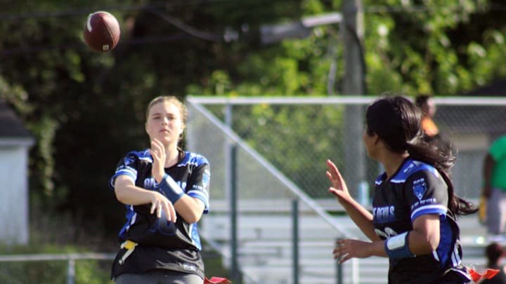 Stanton quarterback Charlee Evoniuk (10) aims a pass toward receiver Kat Banerjea (22) during the Gateway Conference flag football championship against Mandarin on April 21, 2022. [Clayton Freeman/Florida Times-Union]