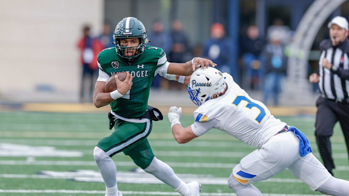 Muskogee runs past Stillwate for a first down during the first half of the OSSAA 6AII State Football Championship Game.