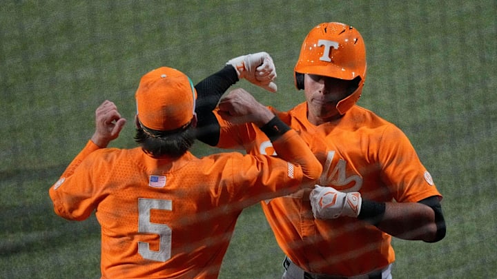 Mar 21, 2025; Tuscaloosa AL, USA; Tennessee infielder Dean Curley (1) is congratulated by Tennessee catcher Cannon Peebles (5) after hitting a two-run homer against Alabama in game two of the series at Sewell-Thomas Stadium.