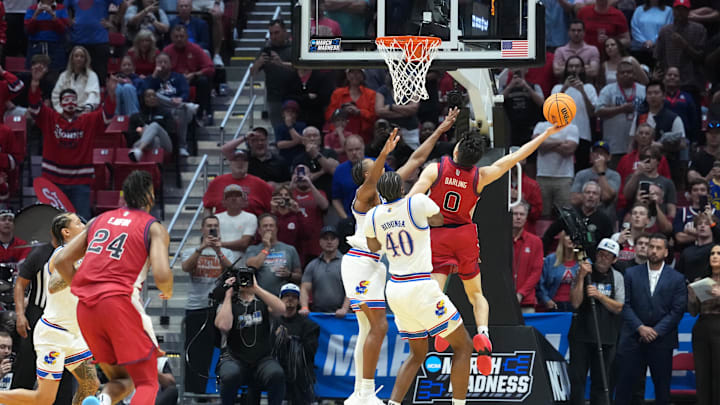 Mar 22, 2026; San Diego, CA, USA; St. John's basketball guard Dylan Darling (0) shoots the game-winning shot against the Kansas Jayhawks in the second half during a second round game of the men's 2026 NCAA Tournament at Viejas Arena.