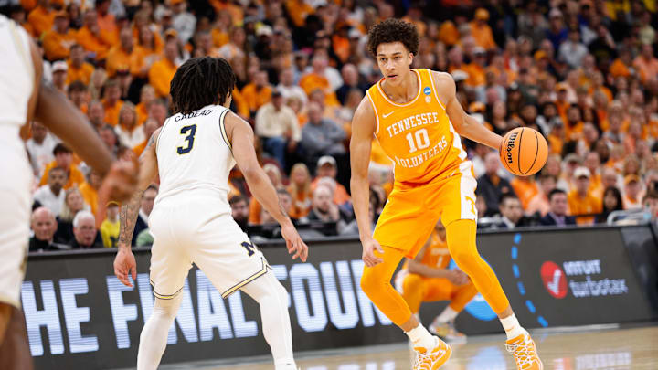 Mar 29, 2026; Chicago, IL, USA; Tennessee Volunteers forward Nate Ament (10) moves the ball while defended by Michigan Wolverines guard Elliot Cadeau (3) in the first half during an Elite Eight game of the Midwest Regional of the men's 2026 NCAA Tournament at United Center. Mandatory Credit: Kamil Krzaczynski-Imagn Images Mar 29, 2026; Chicago, IL, USA; Tennessee Volunteers forward Nate Ament (10) moves the ball while defended by Michigan Wolverines guard Elliot Cadeau (3) in the first half during an Elite Eight game of the Midwest Regional of the men's 2026 NCAA Tournament at United Center. Mandatory Credit: Kamil Krzaczynski-Imagn Images