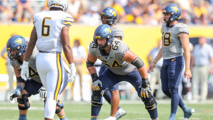 Sep 17, 2022; Morgantown, West Virginia, USA; West Virginia Mountaineers offensive lineman Wyatt Milum (64) during the second quarter against the Towson Tigers at Mountaineer Field at Milan Puskar Stadium. Mandatory Credit: Ben Queen-Imagn Images