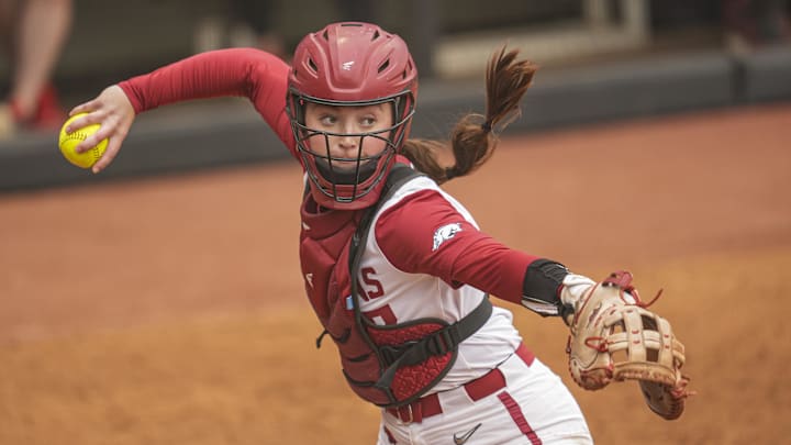 May 7, 2025; Athens, GA, USA; Arkansas catcher Kennedy Miller (17) throws to first base after a dropped third strike against Georgia at Jack Turner Stadium. May 7, 2025; Athens, GA, USA; Arkansas catcher Kennedy Miller (17) throws to first base after a dropped third strike against Georgia at Jack Turner Stadium.