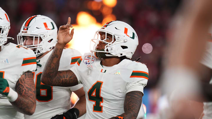 Miami Hurricanes running back Mark Fletcher Jr. (4) takes the field before they play the Ole Miss Rebels during their Vrbo Fiesta Bowl matchup at State Farm Stadium in Glendale, on Jan. 8, 2026.