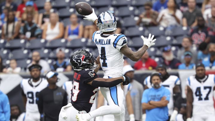Aug 16, 2025; Houston, Texas, USA; Carolina Panthers wide receiver Tetairoa McMillan (4) attempts to make a reception as Houston Texans safety M.J. Stewart (29) defends during the first quarter at NRG Stadium. Mandatory Credit: Troy Taormina-Imagn Images