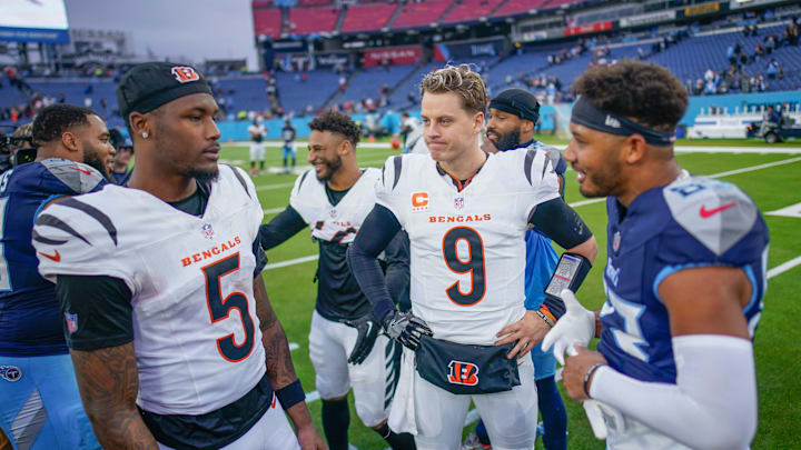 Cincinnati Bengals quarterback Joe Burrow (9) chats with wide receiver Tee Higgins (5) and Tennessee Titans wide receiver Tyler Boyd (83) after the game at Nissan Stadium in Nashville, Tenn., Sunday, Dec. 15, 2024.
