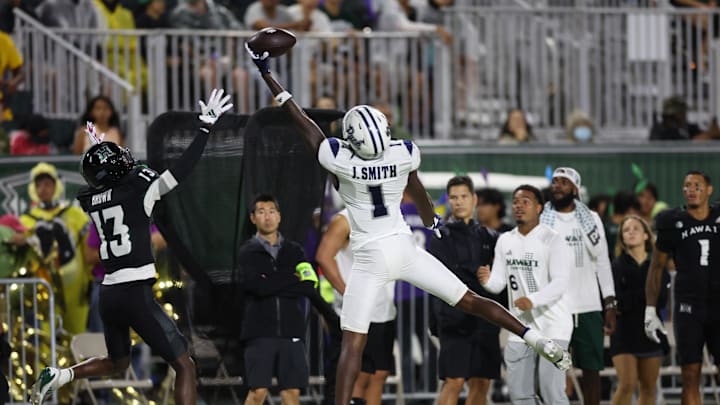 Oct 26, 2024; Honolulu, Hawaii, USA; Nevada Wolf Pack wide receiver Jaden Smith (1) attempts to make a catch over Hawaii Rainbow Warriors defensive back Caleb Brown (13) during the second quarter at the Clarence T.C. Ching Athletics Complex. Smith caught the ball out of bounds. Mandatory Credit: Marco Garcia-Imagn Images Oct 26, 2024; Honolulu, Hawaii, USA; Nevada Wolf Pack wide receiver Jaden Smith (1) attempts to make a catch over Hawaii Rainbow Warriors defensive back Caleb Brown (13) during the second quarter at the Clarence T.C. Ching Athletics Complex. Smith caught the ball out of bounds. Mandatory Credit: Marco Garcia-Imagn Images
