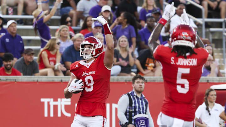 Aug 28, 2025; Houston, Texas, USA; Houston Cougars tight end Tanner Koziol (9) celebrates with wide receiver Stephon Johnson (5) after scoring a touchdown during the first quarter against the Stephen F. Austin Lumberjacks at TDECU Stadium. Mandatory Credit: Troy Taormina-Imagn Images Aug 28, 2025; Houston, Texas, USA; Houston Cougars tight end Tanner Koziol (9) celebrates with wide receiver Stephon Johnson (5) after scoring a touchdown during the first quarter against the Stephen F. Austin Lumberjacks at TDECU Stadium. Mandatory Credit: Troy Taormina-Imagn Images