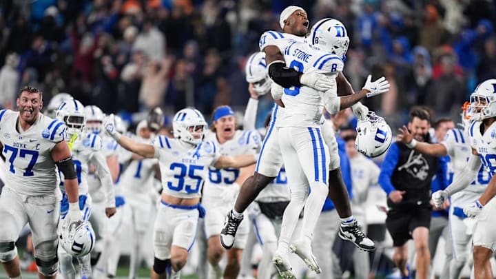 Dec 6, 2025; Charlotte, NC, USA; Duke Blue Devils defensive end Wesley Williams (97) celebrates with safety DaShawn Stone (8) after defeating the Virginia Cavaliers during the 2025 ACC Championship game at Bank of America Stadium. Mandatory Credit: Jim Dedmon-Imagn Images
