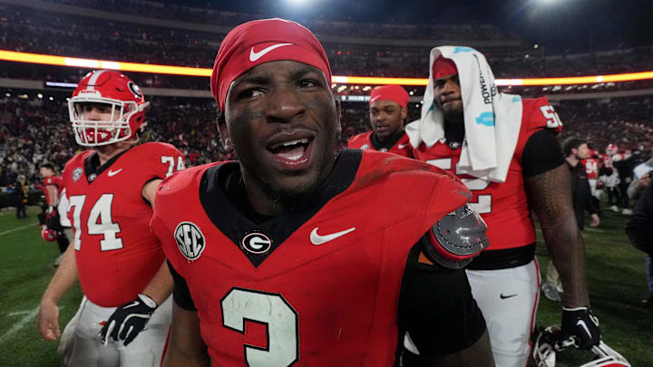 Georgia running back Nate Frazier (3) celebrates after winning a NCAA college football game against Georgia Tech in overtime in Athens, Ga., on Friday, Nov. 29, 2024. Georgia won 44-42.