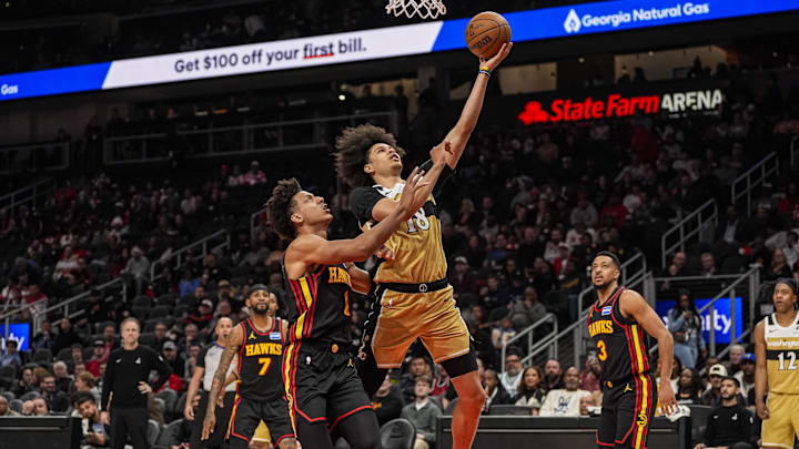Feb 24, 2026; Atlanta, Georgia, USA; Washington Wizards forward Kyshawn George (18) goes to the basket over Atlanta Hawks forward Jalen Johnson (1) during the first half at State Farm Arena. Mandatory Credit: Dale Zanine-Imagn Images Feb 24, 2026; Atlanta, Georgia, USA; Washington Wizards forward Kyshawn George (18) goes to the basket over Atlanta Hawks forward Jalen Johnson (1) during the first half at State Farm Arena. Mandatory Credit: Dale Zanine-Imagn Images