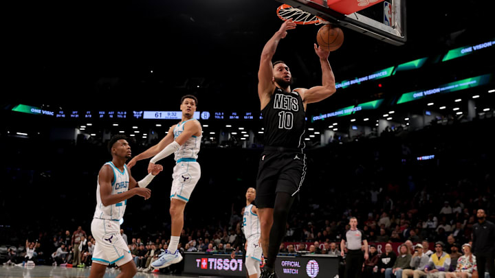 Nov 19, 2024; Brooklyn, New York, USA; Brooklyn Nets guard Ben Simmons (10) dunks against Charlotte Hornets guard Josh Green (10) and forward Brandon Miller (24) during the third quarter at Barclays Center. Mandatory Credit: Brad Penner-Imagn Images Nov 19, 2024; Brooklyn, New York, USA; Brooklyn Nets guard Ben Simmons (10) dunks against Charlotte Hornets guard Josh Green (10) and forward Brandon Miller (24) during the third quarter at Barclays Center. Mandatory Credit: Brad Penner-Imagn Images