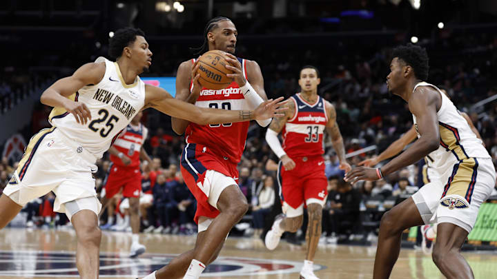 Jan 5, 2025; Washington, District of Columbia, USA; Washington Wizards forward Alexandre Sarr (20) drives to the basket as New Orleans Pelicans guard Trey Murphy III (25) defends in the second quarter at Capital One Arena. Mandatory Credit: Geoff Burke-Imagn Images