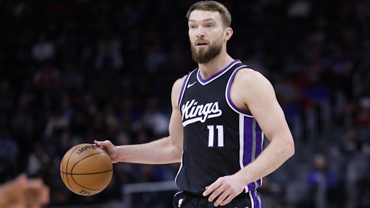 Apr 7, 2025; Detroit, Michigan, USA;  Sacramento Kings forward Domantas Sabonis (11) dribbles in the first half against the Detroit Pistons at Little Caesars Arena. Mandatory Credit: Rick Osentoski-Imagn Images